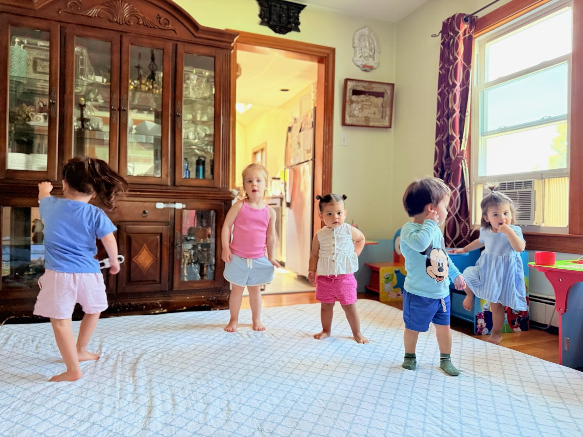 Children enjoying an activity at Rijal Family Child Care
